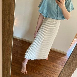 Long elegant pleated white skirt